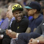 
              Floyd Mayweather Jr. sits courtside during the first half of Game 6 in a second-round NBA basketball playoff series between the Los Angeles Clippers and the Houston Rockets in Los Angeles, Thursday, May 14, 2015. (AP Photo/Jae C. Hong)
            