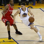 
              Golden State Warriors guard Klay Thompson (11) dribbles against Houston Rockets forward Trevor Ariza (1) during the first half of Game 1 of the NBA basketball Western Conference finals in Oakland, Calif., Tuesday, May 19, 2015. (AP Photo/Tony Avelar)
            