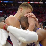 
              Los Angeles Clippers forward Blake Griffin, left, hugs guard Chris Paul after they defeated the San Antonio Spurs in Game 7 in a first-round NBA basketball playoff series, Saturday, May 2, 2015, in Los Angeles. The Clippers won 111-109. (AP Photo/Mark J. Terrill)
            