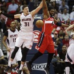 
              Atlanta Hawks' Mike Muscala, left, reaches for a rebound against Washington Wizards' Nene, of Brazil, in the second quarter of Game 5 of the second round of the NBA basketball playoffs Wednesday, May 13, 2015, in Atlanta. (AP Photo/John Bazemore)
            