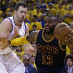 
              Cleveland Cavaliers forward LeBron James (23) drives on Golden State Warriors forward David Lee during the first half of Game 5 of basketball's NBA Finals in Oakland, Calif., Sunday, June 14, 2015. (AP Photo/Ben Margot)
            