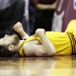 
              In this photo taken Tuesday, June 9, 2015, Cleveland Cavaliers guard Matthew Dellavedova lays on the court after he was fouled by Golden State Warriors guard Stephen Curry while make a basket during the fourth quarter in Game 3 of basketball's NBA Finals in Cleveland. Dellavedova, who has emerged as an unlikely star during this postseason, was hospitalized early Wednesday, June 10, after suffering from severe cramps after the Cavs' 96-91 win Game 3. (AP Photo/Paul Sancya)(AP Photo/Tony Dejak)
            