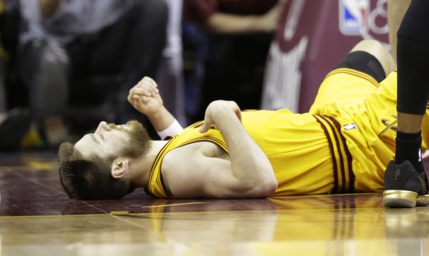 In this photo taken Tuesday, June 9, 2015, Cleveland Cavaliers guard Matthew Dellavedova lays on th...