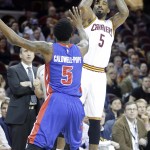 
              FILE - In this April 13, 2015, file photo, Cleveland Cavaliers' J.R. Smith, right, shoots over Detroit Pistons' Kentavious Caldwell-Pope in the first quarter of an NBA basketball game in Cleveland.  The enigmatic shooting guard, who came to the Cavaliers with the reputation of being diffcult, has found a new home in Cleveland and he's relishing the chance to be part of a team moving toward an NBA title. (AP Photo/Mark Duncan, File)
            