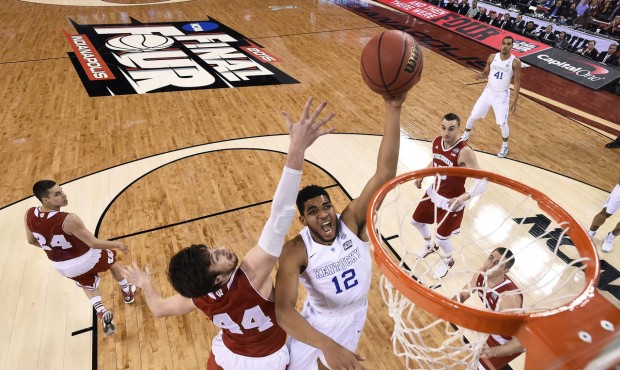 FILE – In this April 4, 2015, file photo, Kentucky’s Karl-Anthony Towns (12) drives to ...