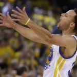 
              Golden State Warriors guard Stephen Curry reacts after scoring during the first half of Game 5 in a second-round NBA playoff basketball series against the Memphis Grizzlies in Oakland, Calif., Wednesday, May 13, 2015. (AP Photo/Ben Margot)
            