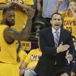 
              Cleveland Cavaliers head coach David Blatt yells at his team as LeBron James (23) looks on in overtime of Game 3 of the Eastern Conference finals of the NBA basketball playoffs against the Atlanta Hawks Sunday, May 24, 2015, in Cleveland. The Cavaliers won, 114-111, to take a 3-0 series lead. (AP Photo/Ron Schwane)
            