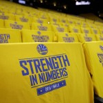 
              Golden State Warriors t-shirts are shown on seats at Oracle Arena before Game 1 of basketball's NBA Finals between the Warriors and the Cleveland Cavaliers in Oakland, Calif., Thursday, June 4, 2015. (AP Photo/Ben Margot)
            