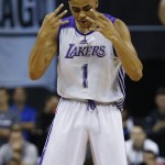 
              Los Angeles Lakers’ D'Angelo Russell reacts after scoring against the Minnesota Timberwolves during the first half of their NBA summer league basketball game Friday, July 10, 2015, in Las Vegas. (AP Photo/John Locher)
            