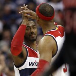 
              Washington Wizards guard John Wall (2) celebrates with forward Paul Pierce (34) during the second half of Game 3 in the first round of the NBA basketball playoffs against the Toronto Raptors, Friday, April 24, 2015, in Washington. The Wizards won 106-99. (AP Photo/Alex Brandon)
            