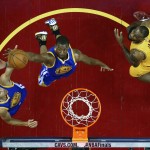               Golden State Warriors guard Stephen Curry (30), left, and teammate forward Harrison Barnes (40) go for a rebound over Cleveland Cavaliers forward LeBron James (23) during the first half of Game 4 of basketball's NBA Finals in Cleveland, Thursday, June 11, 2015. (Ronald Martinez/Pool Photo via AP)
            