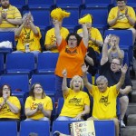 
              Tulsa Shock fans cheer during a WNBA basketball game against the Washington Mystics in Tulsa, Okla., Tuesday, July 21, 2015. In the front row, from left, are Jeannie Bennett, Annakaye Bennett, Cindy Dronyk and Mike Dronyk. Cheering behind them is Beth Persac. Shock majority owner  Bill Cameron announced plans to move the franchise to the Dallas-Fort Worth market as early as next season. (AP Photo/Sue Ogrocki)
            