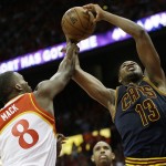 
              Cleveland Cavaliers center Tristan Thompson (13) shoots against Atlanta Hawks guard Shelvin Mack (8) during the second half in Game 2 of the Eastern Conference finals of the NBA basketball playoffs, Friday, May 22, 2015, in Atlanta. (AP Photo/David Goldman)
            