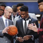 
              NBA Commissioner Adam Silver, left, talks with Emmanuel Mudiay, center, Karl-Anthony Towns. back center, and Kelly Oubre Jr., right, before the NBA basketball draft, Thursday, June 25, 2015, in New York. (AP Photo/Kathy Willens)
            