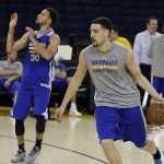 
              Golden State Warriors' Klay Thompson, right, drives the ball behind Stephen Curry (30) during NBA basketball practice, Wednesday, June 3, 2015, in Oakland, Calif. The Warriors host the Cleveland Cavaliers in Game 1 of the NBA Finals on Thursday. (AP Photo/Ben Margot)
            