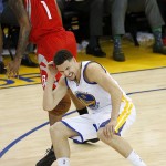 
              In this photo taken May 27, 2015, Golden State Warriors guard Klay Thompson (11) reacts after taking a knee to his head from Houston Rockets forward Trevor Ariza (1) during the second half of Game 5 of the NBA basketball Western Conference finals. The Warriors hope to get healthy and stay in tune over the next week before facing the Cleveland Cavaliers in the NBA Finals. Thompson needs to pass through the league's concussion protocol and Stepehen Curry is trying to get his aching body back at full strength.  (AP Photo/Tony Avelar)
            