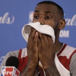 
              Cleveland Cavaliers' LeBron James wipes his face during NBA basketball news conference, Friday, June 5, 2015, in Oakland, Calif. The Golden State Warriors host the Cavaliers in Game 2 of the NBA Finals on Sunday. (AP Photo/Ben Margot)
            