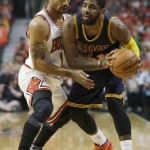 
              Cleveland Cavaliers guard Kyrie Irving, right, looks to a pass as Chicago Bulls guard Derrick Rose applies pressure during the first half of Game 3 in a second-round NBA basketball playoff series in Chicago on Friday, May 8, 2015. (AP Photo/Nam Y. Huh)
            