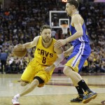 
              Cleveland Cavaliers guard Matthew Dellavedova (8) drives on Golden State Warriors guard Klay Thompson (11) during the first half of Game 3 of basketball's NBA Finals in Cleveland, Tuesday, June 9, 2015. (AP Photo/Tony Dejak)
            