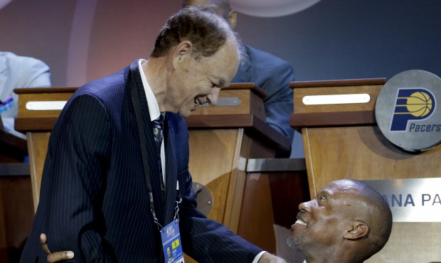 Minnesota Timberwolves owner, Glen Taylor, left, talks with Los Angeles Lakers coach Byron Scott be...