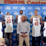 
              Los Angeles Clippers, head coach Doc Rivers, center, poses team players, from left, Branden Dawson, 22, DeAndre Jordan, 6, Austin Rivers, 25, Josh Smith, 5, Cole Aldrich, 45, Paul Pierce, 34, and Wesley Johnson, 33, far right, at at a news conference in Los Angeles on Tuesday, July 21, 2015. The Clippers managed to keep DeAndre Jordan after he changed his mind about his verbal commitment to  Dallas Mavericks. They offered everything he wanted, including a fresh start and a bigger offensive role. When Jordan thought about it a little more, the craziest free-agent recruitment story in recent NBA history ended with him back on the Los Angeles Clippers. (AP Photo/Nick Ut)
            