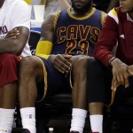 
              Cleveland Cavaliers forward LeBron James (23) sits on the bench during the second half of Game 5 of basketball's NBA Finals against the Golden State Warriors in Oakland, Calif., Sunday, June 14, 2015. The Warriors won 104-91. (AP Photo/Ben Margot)
            