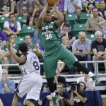               Boston Celtics' Marcus Smart (36) catches a pass as Utah Jazz's Bryce Cotton (8) looks on during the first half of an NBA summer league basketball game Monday, July 6, 2015, in Salt Lake City.  (AP Photo/Rick Bowmer)
            