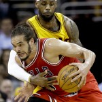 
              Cleveland Cavaliers forward LeBron James (23) tries to knock the ball loose from Chicago Bulls center Joakim Noah (13) during the second half of Game 2 in a second-round NBA basketball playoff series Wednesday, May 6, 2015, in Cleveland. (AP Photo/Tony Dejak)
            