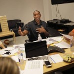 
              In this July 14, 2015, photo, New York Liberty President IsiahThomas, center, speaks to co-workers at a coaches meeting, including head coach Bill Laimbeer, right, and general manager Kristin Bernert, after a team practice in Greenburgh, N.Y. Controversy swirled around New York when Thomas was hired in May as the team’s president and potential owner. (AP Photo/Seth Wenig)
            