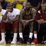               Cleveland Cavaliers guard Shawn Marion, from left, center Kendrick Perkins, forward LeBron James and forward James Jones sit on the bench during the second half of Game 5 of basketball's NBA Finals against the Golden State Warriors in Oakland, Calif., Sunday, June 14, 2015. The Warriors won 104-91. (AP Photo/Ben Margot)
            