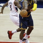 
              Cleveland Cavaliers forward LeBron James (23) passes the ball as Atlanta Hawks forward DeMarre Carroll (5) looks on during the second half in Game 1 of the Eastern Conference finals of the NBA basketball playoffs, Wednesday, May 20, 2015, in Atlanta. (AP Photo/David Goldman)
            