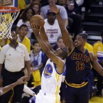 
              Golden State Warriors forward Andre Iguodala (9) dunks against Cleveland Cavaliers center Tristan Thompson (13) during the first half of Game 1 of basketball's NBA Finals in Oakland, Calif., Thursday, June 4, 2015. (AP Photo/Eric Risberg)
            