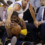 
              Cleveland Cavaliers guard Kyrie Irving, bottom, is guarded by Golden State Warriors guard Stephen Curry during the second half of Game 1 of basketball's NBA Finals in Oakland, Calif., Thursday, June 4, 2015. (AP Photo/Ben Margot)
            