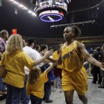 
              In this May 15, 2010, photo, fans high-five Tulsa Shock's Amber Holt after the Shock lost their inaugural game to the Minnesota Lynx in Tulsa, Okla. Tulsa Shock majority owner Bill Cameron announced plans Monday, July 20, 2015,  to move the WNBA franchise to the Dallas-Fort Worth market. (Stephen Holman/Tulsa World via AP) ONLINE OUT; KOTV OUT; KJRH OUT; KTUL OUT; KOKI OUT; KQCW OUT; KDOR OUT; TULSA OUT; TULSA ONLINE OUT
            