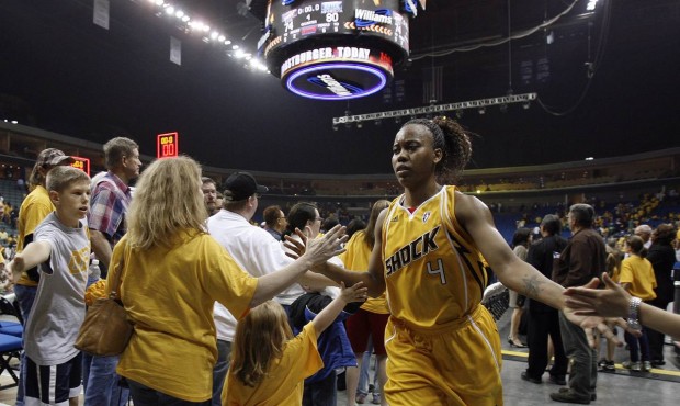 In this May 15, 2010, photo, fans high-five Tulsa Shock’s Amber Holt after the Shock lost the...