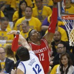 
              Houston Rockets center Dwight Howard, right, shoots against Golden State Warriors center Andrew Bogut during the first half of Game 5 of the NBA basketball Western Conference finals in Oakland, Calif., Wednesday, May 27, 2015. (AP Photo/Tony Avelar)
            