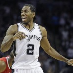               San Antonio Spurs' Kawhi Leonard (2) calls to teammates during the first half of Game 3 in an NBA basketball first-round playoff series against the Los Angeles Clippers, Friday, April 24, 2015, in San Antonio. (AP Photo/Darren Abate)
            