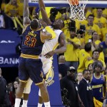 
              Golden State Warriors forward Draymond Green, right, blocks a shot attempt by Cleveland Cavaliers forward LeBron James during the overtime period of Game 2 of basketball's NBA Finals in Oakland, Calif., Sunday, June 7, 2015. The Cavaliers won 95-93 in overtime. (AP Photo/Ben Margot)
            