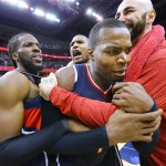 
              Atlanta Hawks' DeMarre Carroll, Al Horford, Paul Millsap and Pero Antic, from left, celebrate after the Hawks defeated the Washington Wizards 94-91 in Game 6 of an NBA basketball playoffs second-round series, Friday, May 15, 2015, in Washington. The win sent the Hawks to the Eastern Conference finals. (Curtis Compton/Atlanta Journal-Constitution via AP)
            