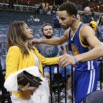 
              Golden State Warriors guard Stephen Curry hugs his mother, Sonya Curry, after the Warriors beat the Memphis Grizzlies in Game 6 of a second-round NBA basketball Western Conference playoff series Friday, May 15, 2015, in Memphis, Tenn. The Warriors won 108-95 to win the series 4-2. (AP Photo/Mark Humphrey)
            