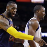 
              Cleveland Cavaliers forward LeBron James reacts next to Golden State Warriors forward Harrison Barnes during the second half of Game 1 of basketball's NBA Finals in Oakland, Calif., Thursday, June 4, 2015. (AP Photo/Ben Margot)
            