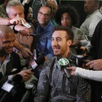 
              FILE - In this May 14, 2015, file photo, Wisconsin's Frank Kaminsky, center, smiles as he responds to a question during the NBA basketball combine in Chicago. Summer leagues begin this weekend in Orlando, Florida, games in Salt Lake City set to tip-off on Monday and the 24-team fan-friendly event in Las Vegas opening on July 10. (AP Photo/Charles Rex Arbogast, File)
            