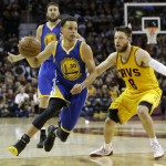 
              Golden State Warriors guard Stephen Curry (30) drives on Cleveland Cavaliers guard Matthew Dellavedova (8) during the second half of Game 3 of basketball's NBA Finals in Cleveland, Tuesday, June 9, 2015. (AP Photo/Tony Dejak)
            