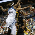 
              Tulsa Shock guard Skylar Diggins (4) jumps to the basket against Minnesota Lynx forward Rebekkah Brunson (32) during the first half of a WNBA basketball game, Sunday, June 21, 2015, in Minneapolis. (AP Photo/Stacy Bengs)
            