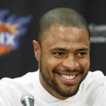               Phoenix Suns' Tyson Chandler, the newly signed free agent, smiles as he is introduced to the media during a news conference Thursday, July 9, 2015, in Phoenix. (AP Photo/Ross D. Franklin)
            