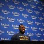 
              Cleveland Cavaliers forward LeBron James smiles during a press conference for basketball's NBA Finals in Cleveland, Wednesday, June 10, 2015. The Cavaliers lead the Warriors 2-1 in the best-of-seven games series.  Game 4 is scheduled for Thursday. (AP Photo/Paul Sancya)
            