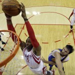 
              Houston Rockets center Dwight Howard, left, dunks as Golden State Warriors center Andrew Bogut, right, defends during the first half in Game 3 of the Western Conference finals of the NBA basketball playoffs, Saturday, May 23, 2015, in Houston. (AP Photo/David J. Phillip, Pool)
            