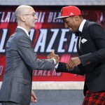 
              Rondae Hollis-Jefferson, right, greets NBA Commissioner Adam Silver after being selected 23rd overall by the Portland Trail Blazers during the NBA basketball draft, Thursday, June 25, 2015, in New York. (AP Photo/Kathy Willens)
            