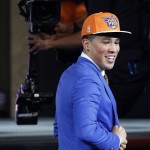               Devin Booker reacts after being selected 13th overall by the Phoenix Suns during the NBA basketball draft, Thursday, June 25, 2015, in New York. (AP Photo/Kathy Willens)
            
