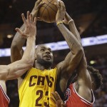 
              Cleveland Cavaliers forward LeBron James (23) goes up for a shot against Chicago Bulls guard Derrick Rose, right, during the second half of Game 5 in a second-round NBA basketball playoff series Tuesday, May 12, 2015, in Cleveland. (AP Photo/Tony Dejak)
            
